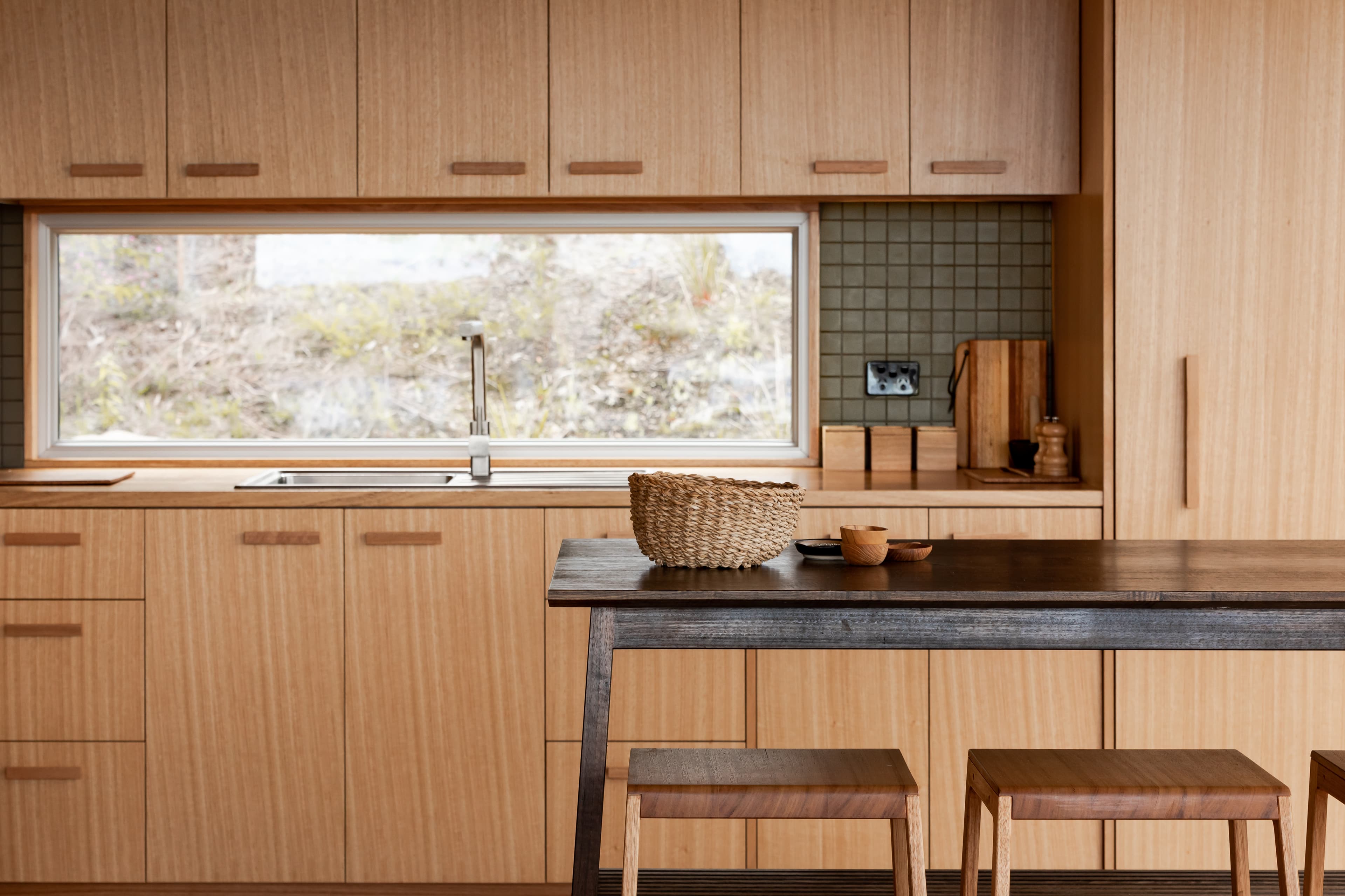 Timber kitchen with dining bench and stools